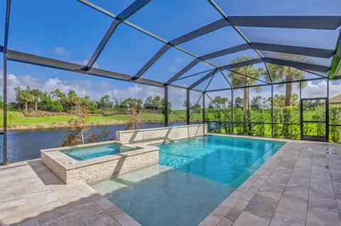 a view of a swimming pool with a patio