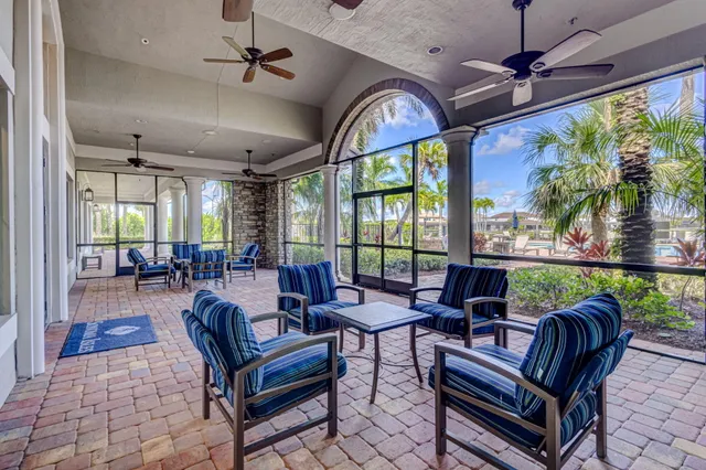 a view of a house with a yard and sitting area