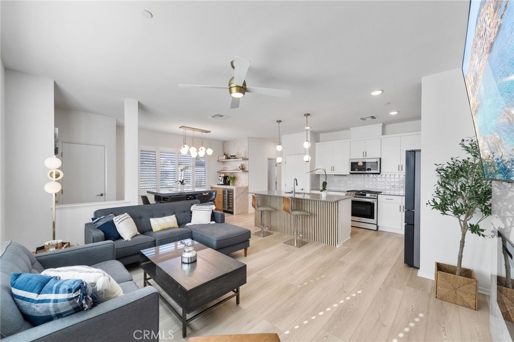 303 Sweet Place Fallbrook, CA 92028 - Photo 11 of 59 a living room with furniture kitchen and a table