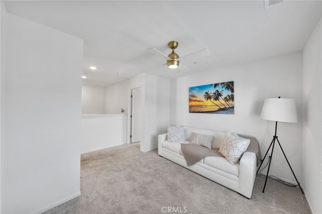 303 Sweet Place Fallbrook, CA 92028 - Photo 16 of 59 a living room with furniture and a lamp