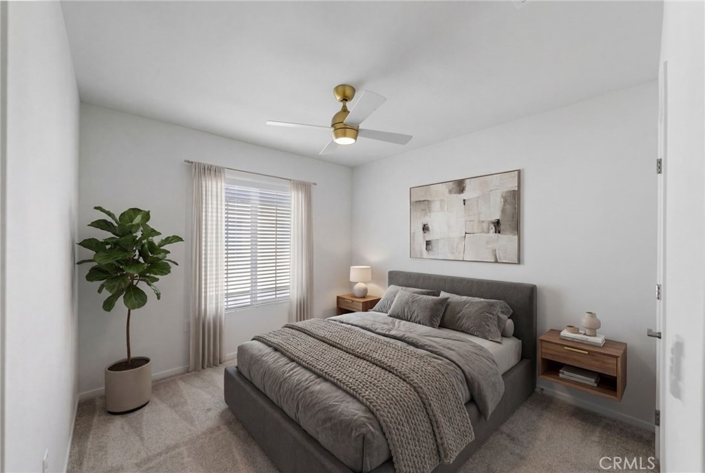 303 Sweet Place Fallbrook, CA 92028 - Photo 22 of 59 a bedroom with a bed and a potted plant