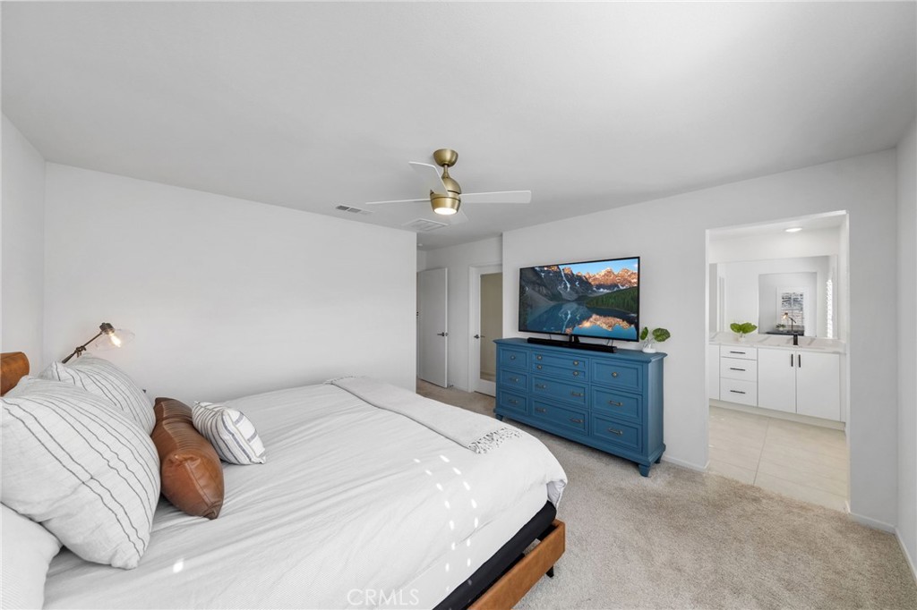 303 Sweet Place Fallbrook, CA 92028 - Photo 25 of 59 a bedroom with a bed and a dresser