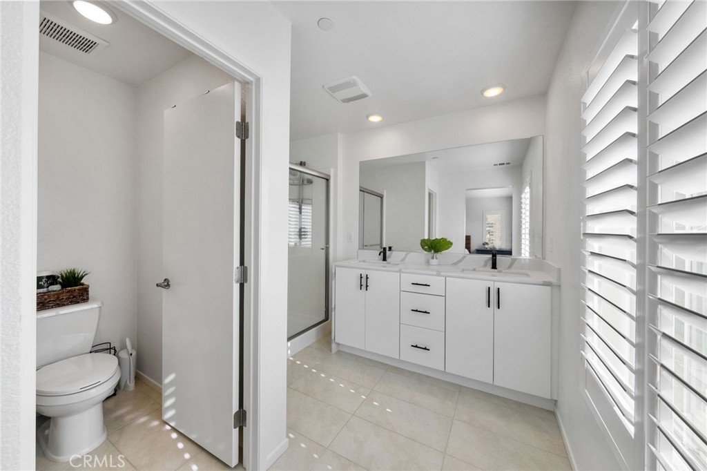 303 Sweet Place Fallbrook, CA 92028 - Photo 26 of 59 a bathroom with a granite countertop sink toilet and shower