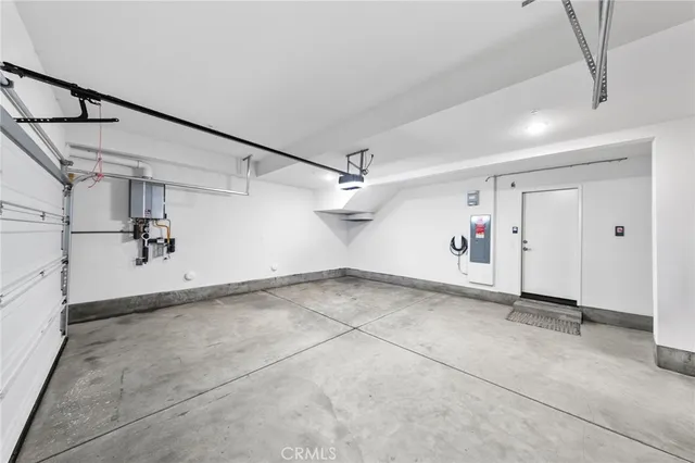 a view of a white house with a yard next to a road