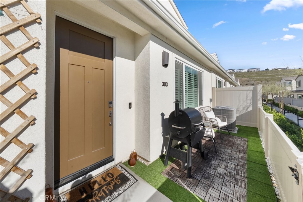 303 Sweet Place Fallbrook, CA 92028 - Photo 33 of 59 a view of balcony with chair and tables