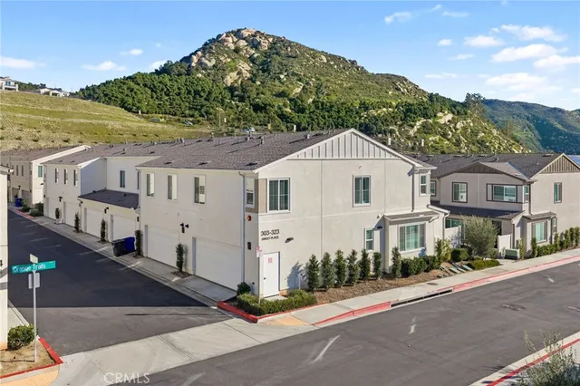 a view of a houses with a lake and a mountain view