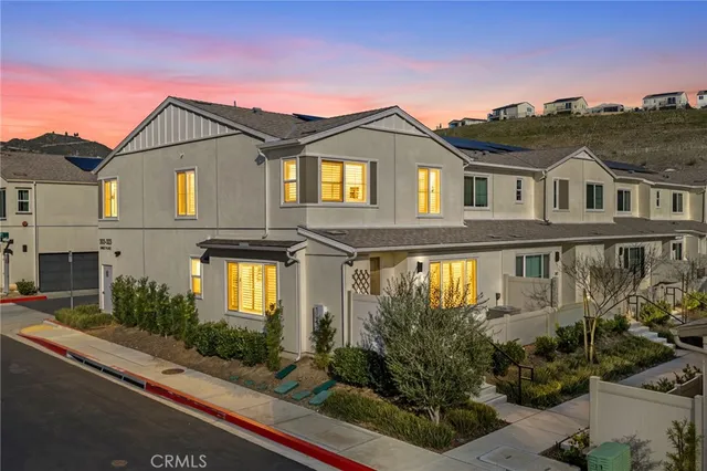 a front view of a house with a garage