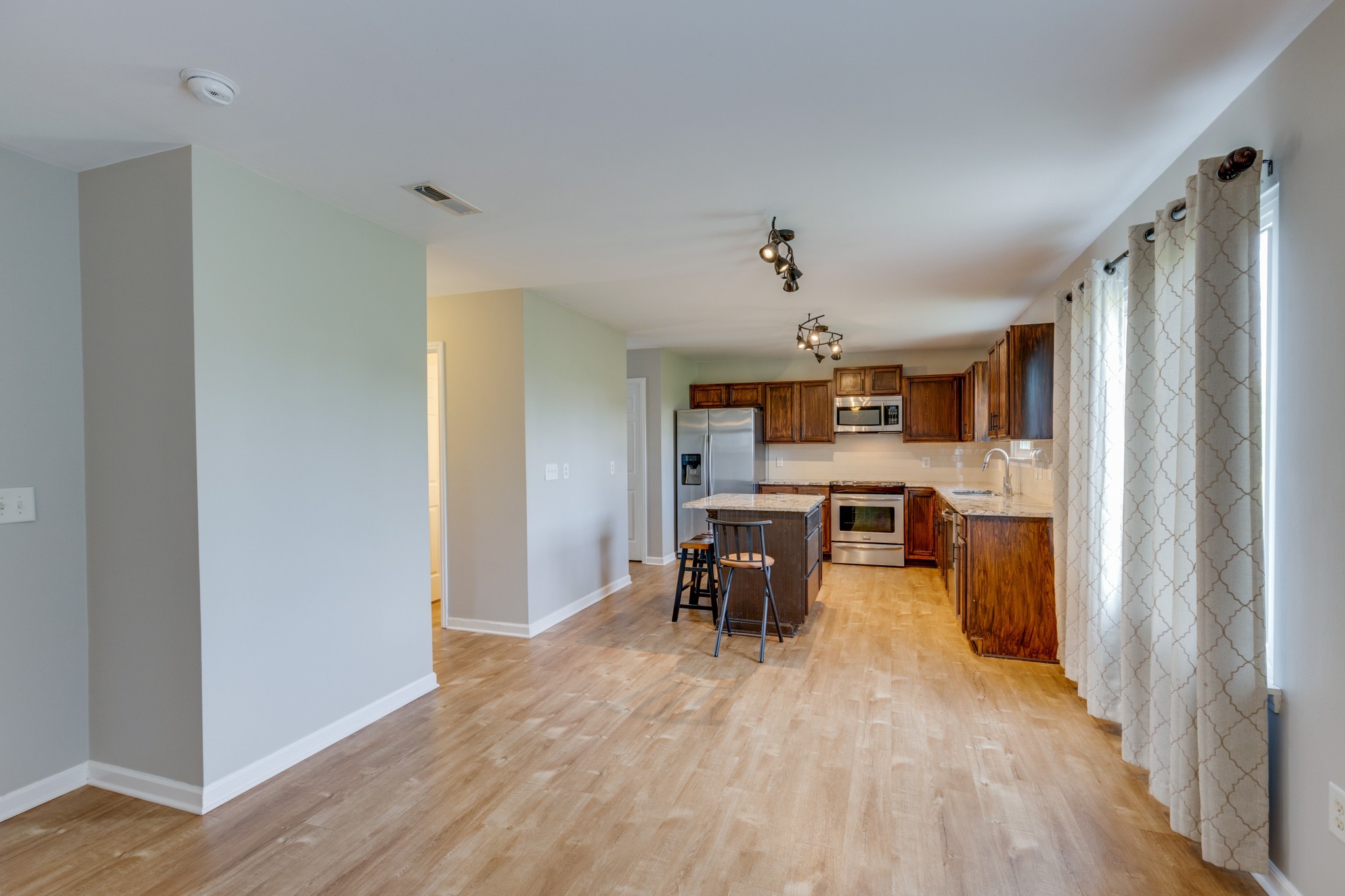 4017 Cadence Drive Spring Hill, TN 37174 - Photo 13 of 38 a view of a kitchen and dining room