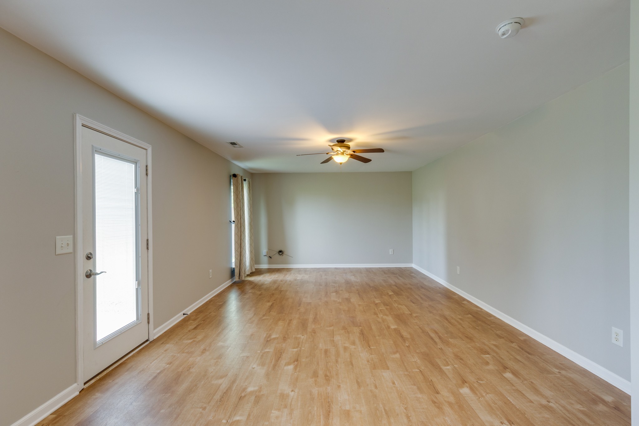 4017 Cadence Drive Spring Hill, TN 37174 - Photo 18 of 38 a view of an empty room with wooden floor