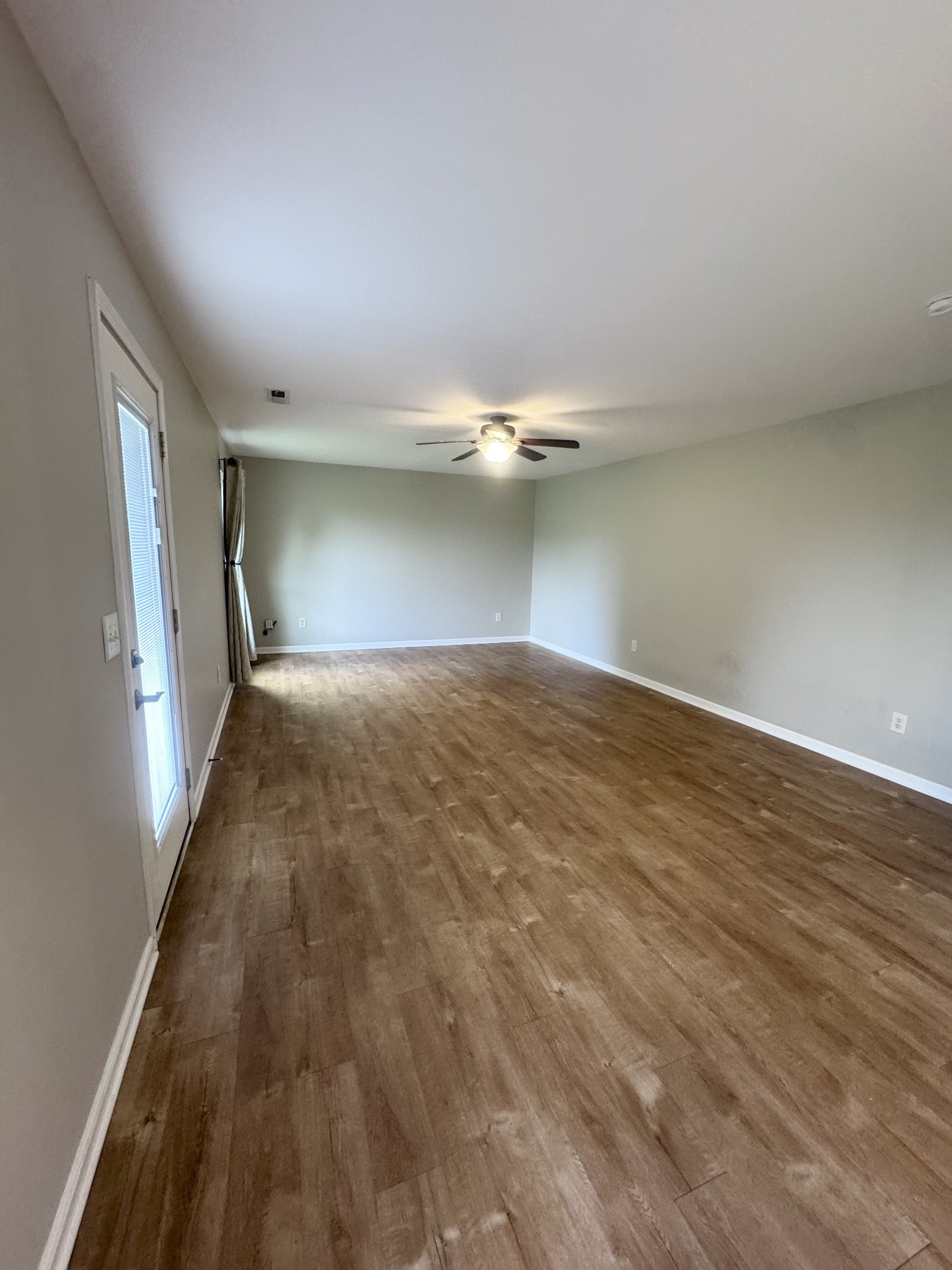 4017 Cadence Drive Spring Hill, TN 37174 - Photo 19 of 38 a view of empty room with wooden floor