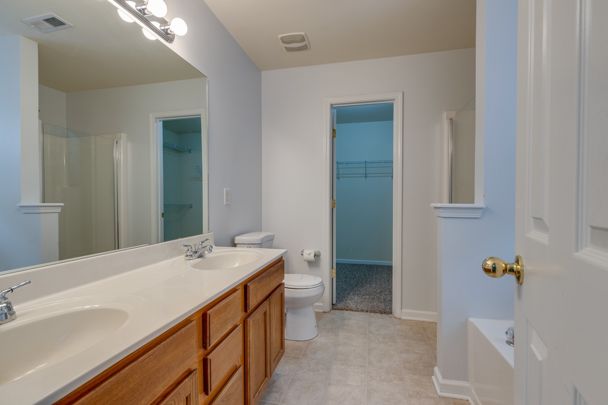 4017 Cadence Drive Spring Hill, TN 37174 - Photo 26 of 38 a bathroom with a sink a toilet and shower