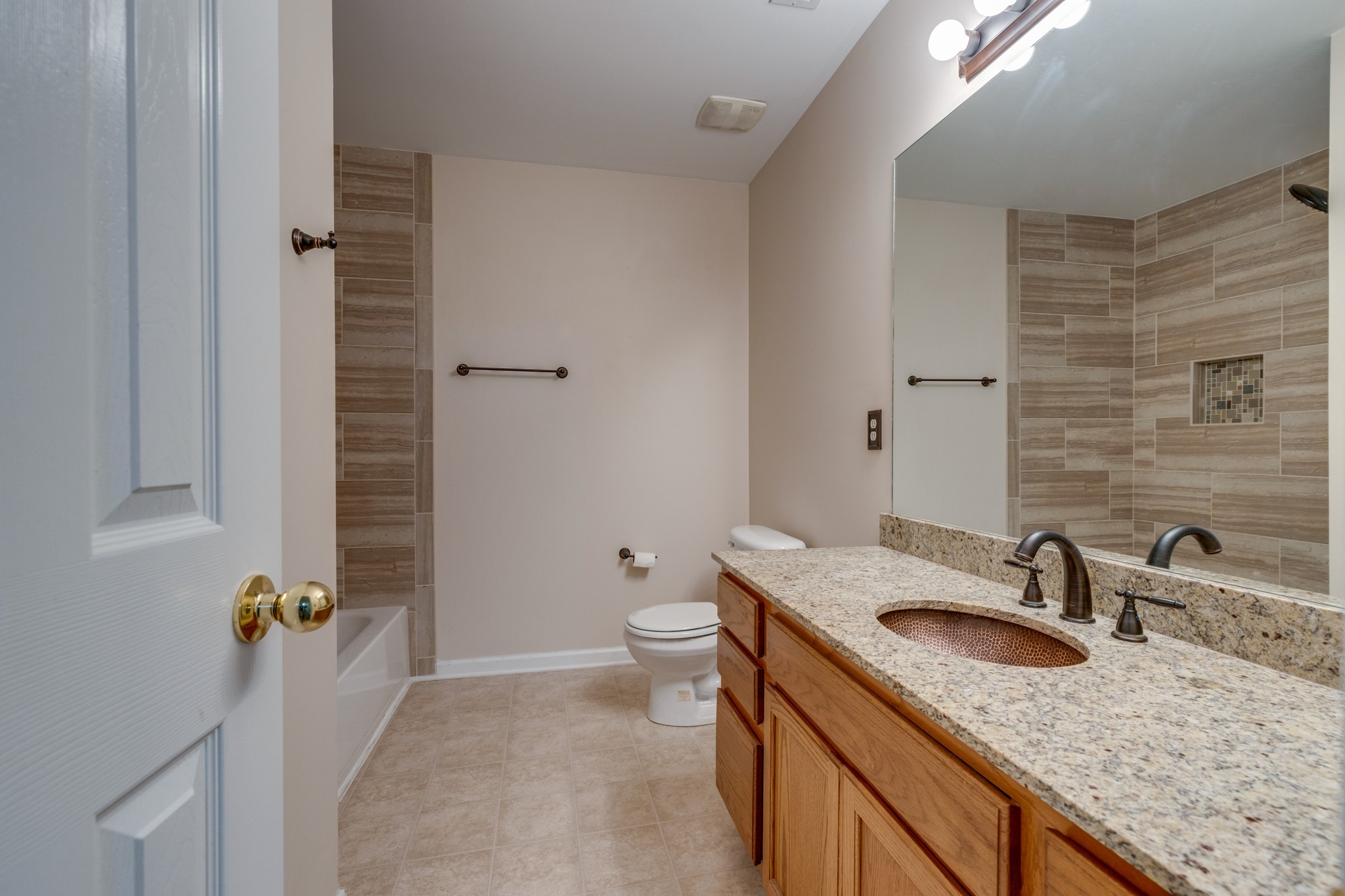 4017 Cadence Drive Spring Hill, TN 37174 - Photo 30 of 38 a bathroom with a granite countertop sink a toilet and shower
