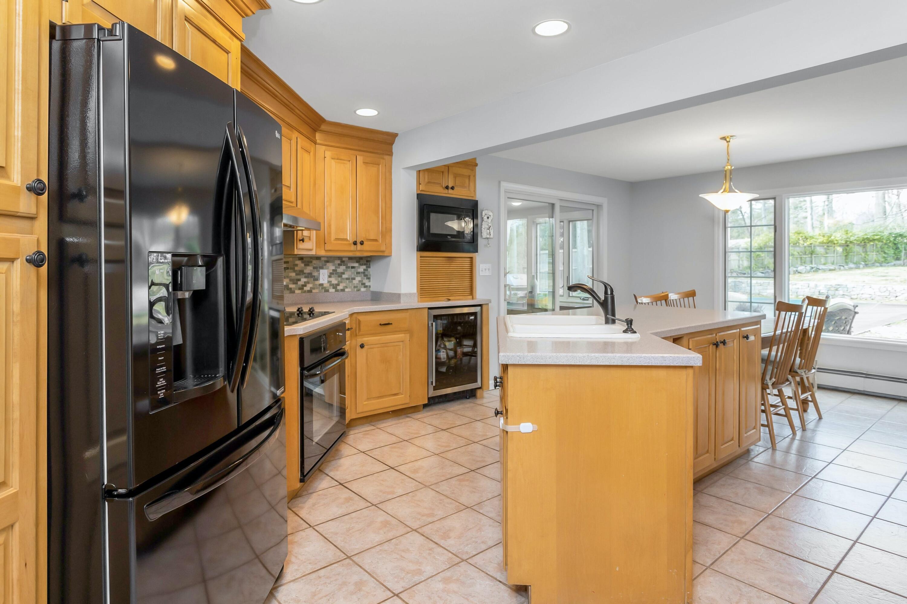 21 Revere Road Darien, CT 06820 - Photo 11 of 40 a kitchen with counter top space cabinets and stainless steel appliances