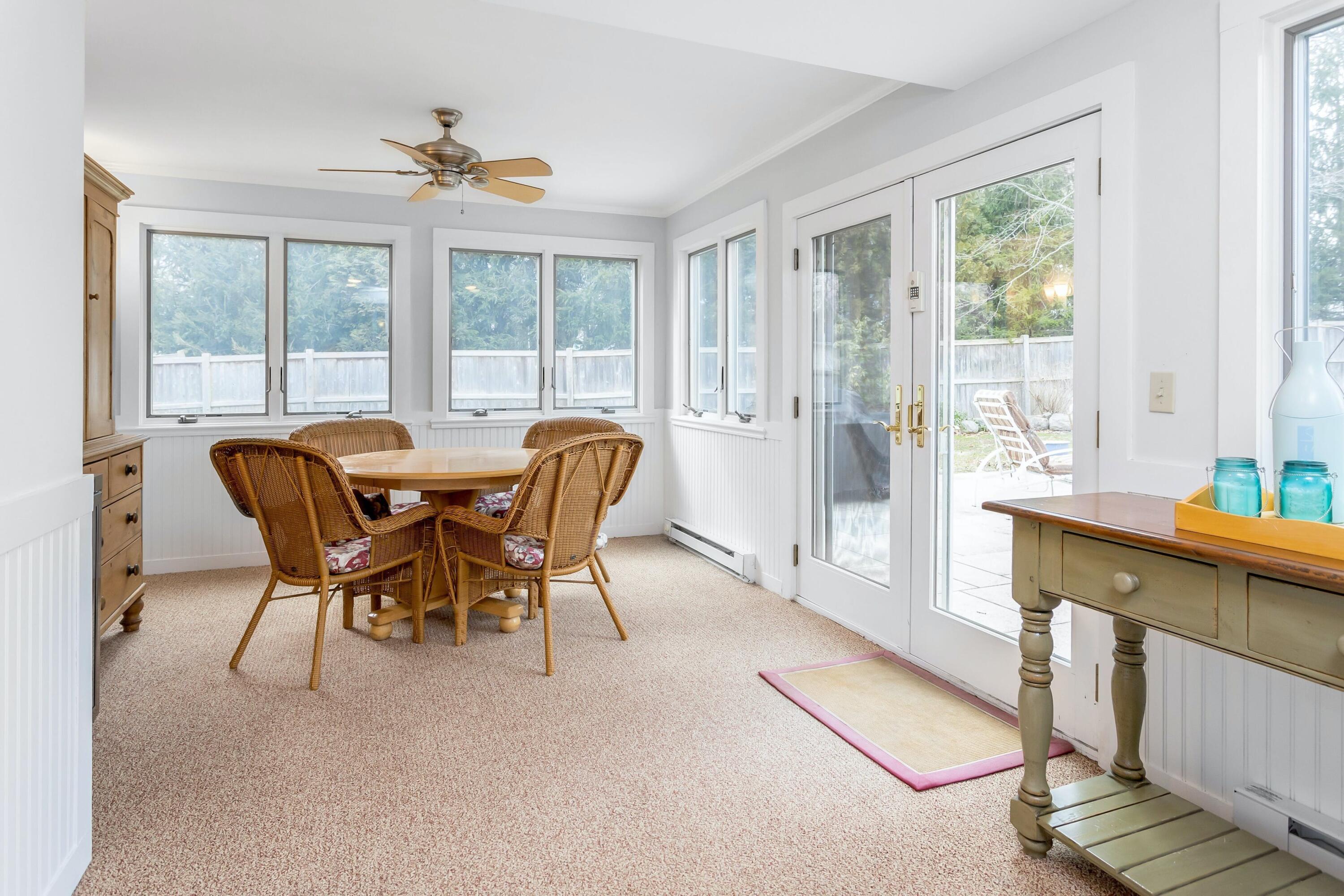 21 Revere Road Darien, CT 06820 - Photo 12 of 40 a dining room with furniture and large windows