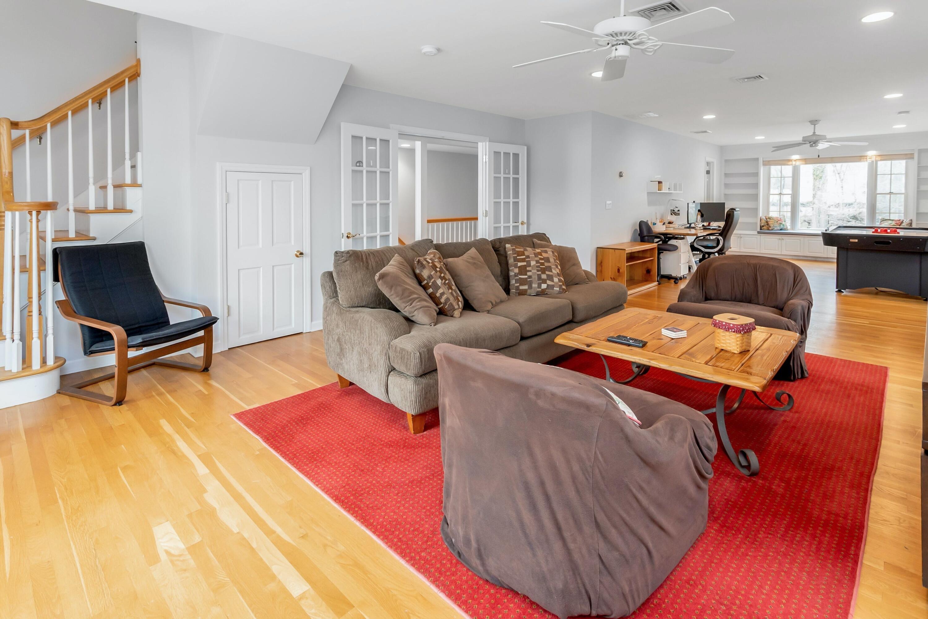 21 Revere Road Darien, CT 06820 - Photo 18 of 40 a living room with furniture and a wooden floor