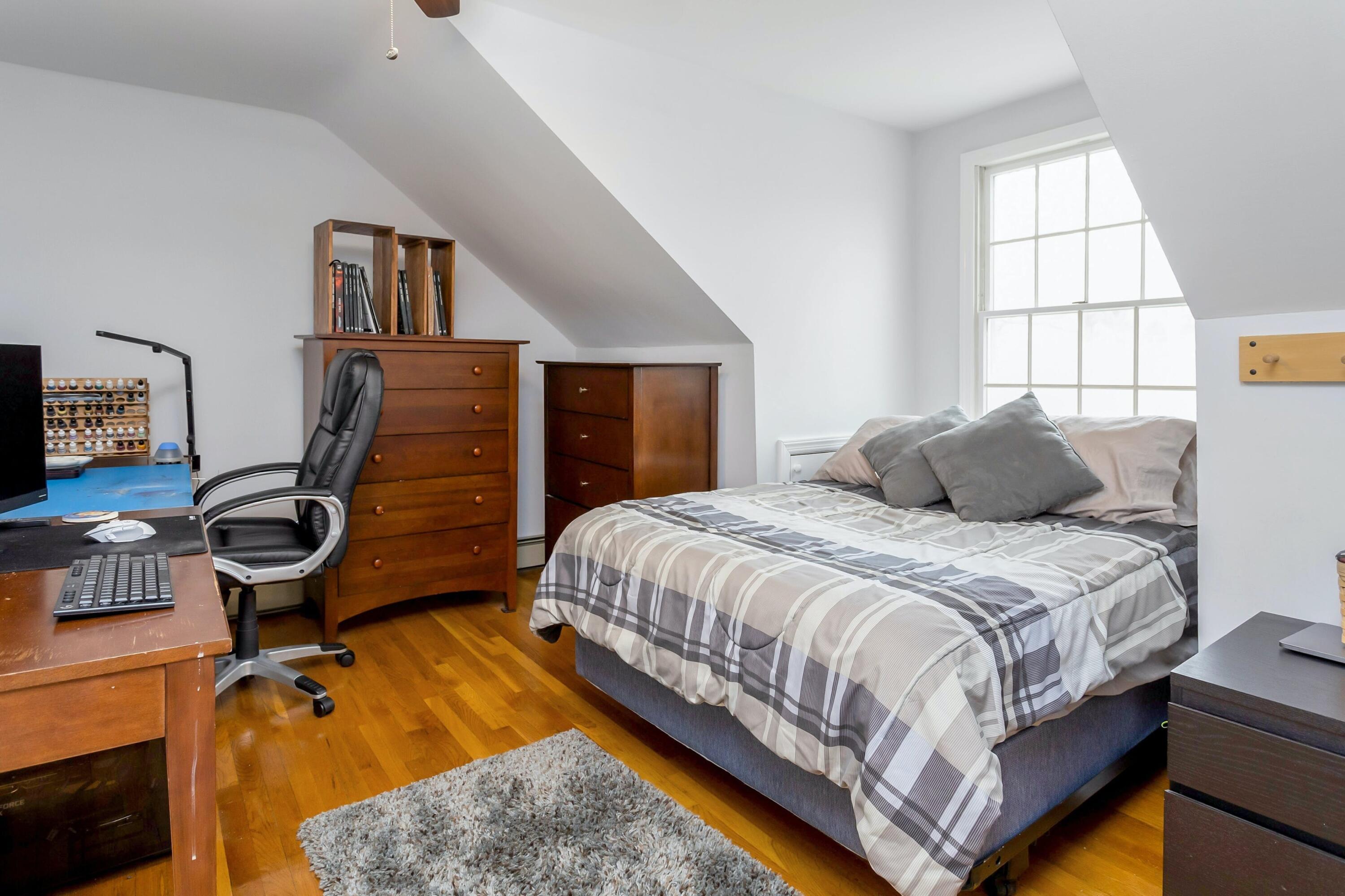21 Revere Road Darien, CT 06820 - Photo 29 of 40 a bedroom with a bed and wooden floor