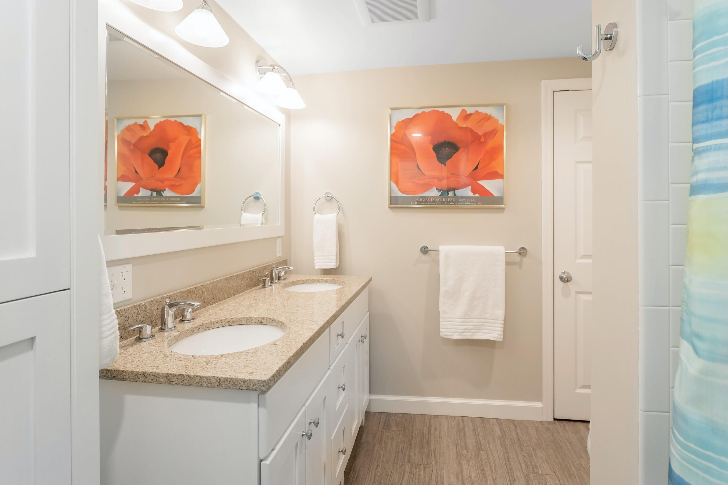21 Revere Road Darien, CT 06820 - Photo 30 of 40 a bathroom with a painting on the wall and a sink