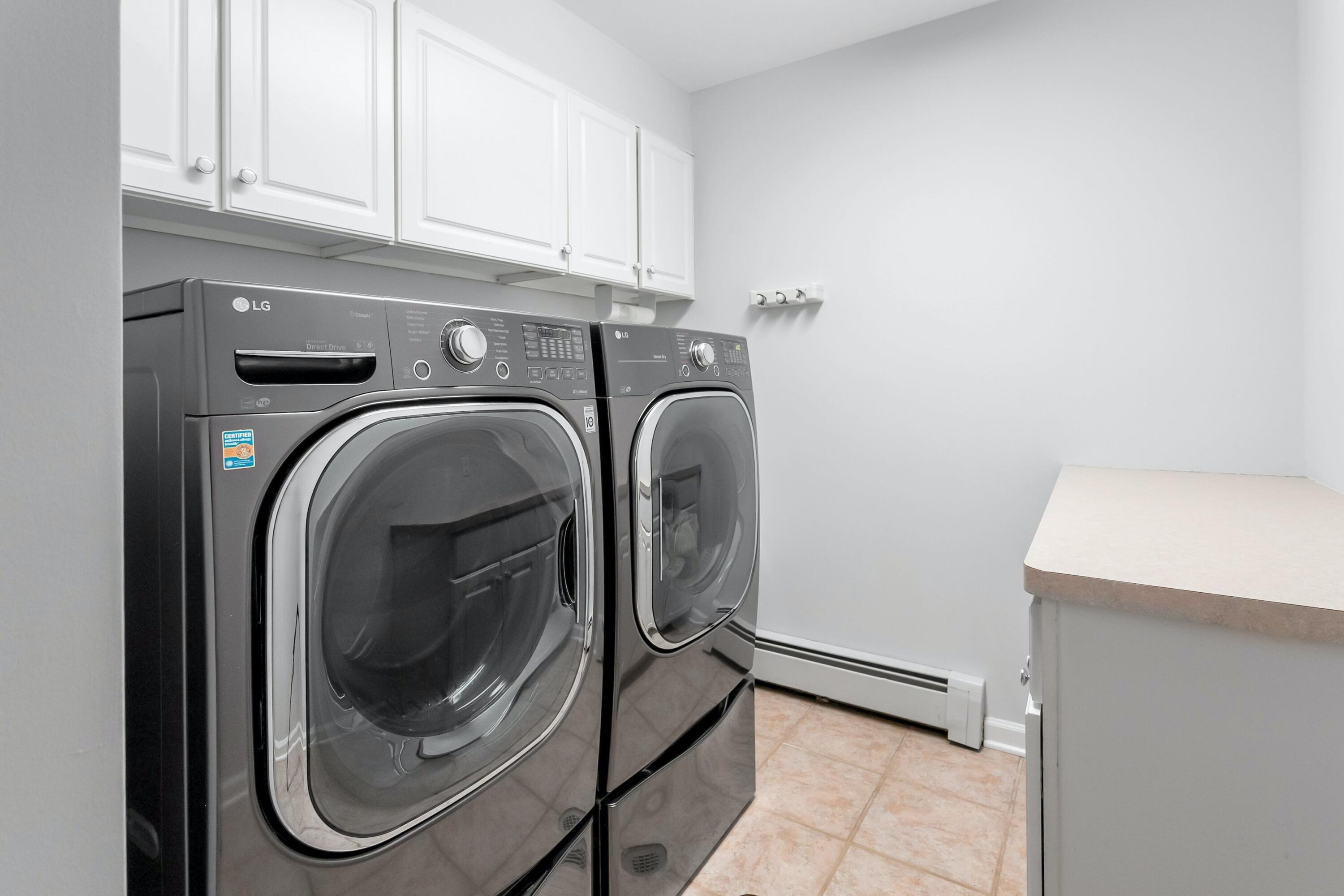 21 Revere Road Darien, CT 06820 - Photo 33 of 40 a utility room with dryer and washer