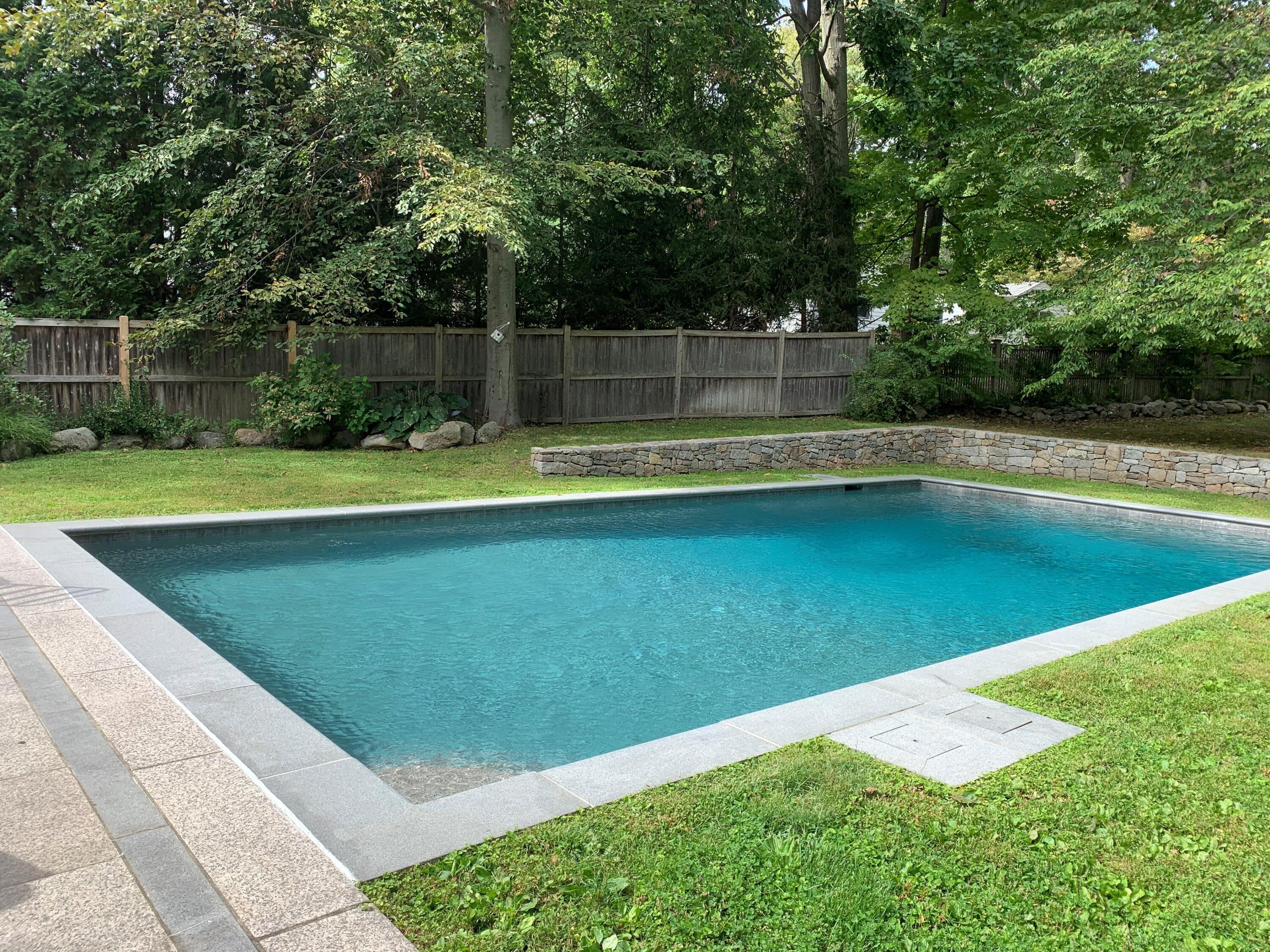 21 Revere Road Darien, CT 06820 - Photo 34 of 40 a view of a backyard with swimming pool