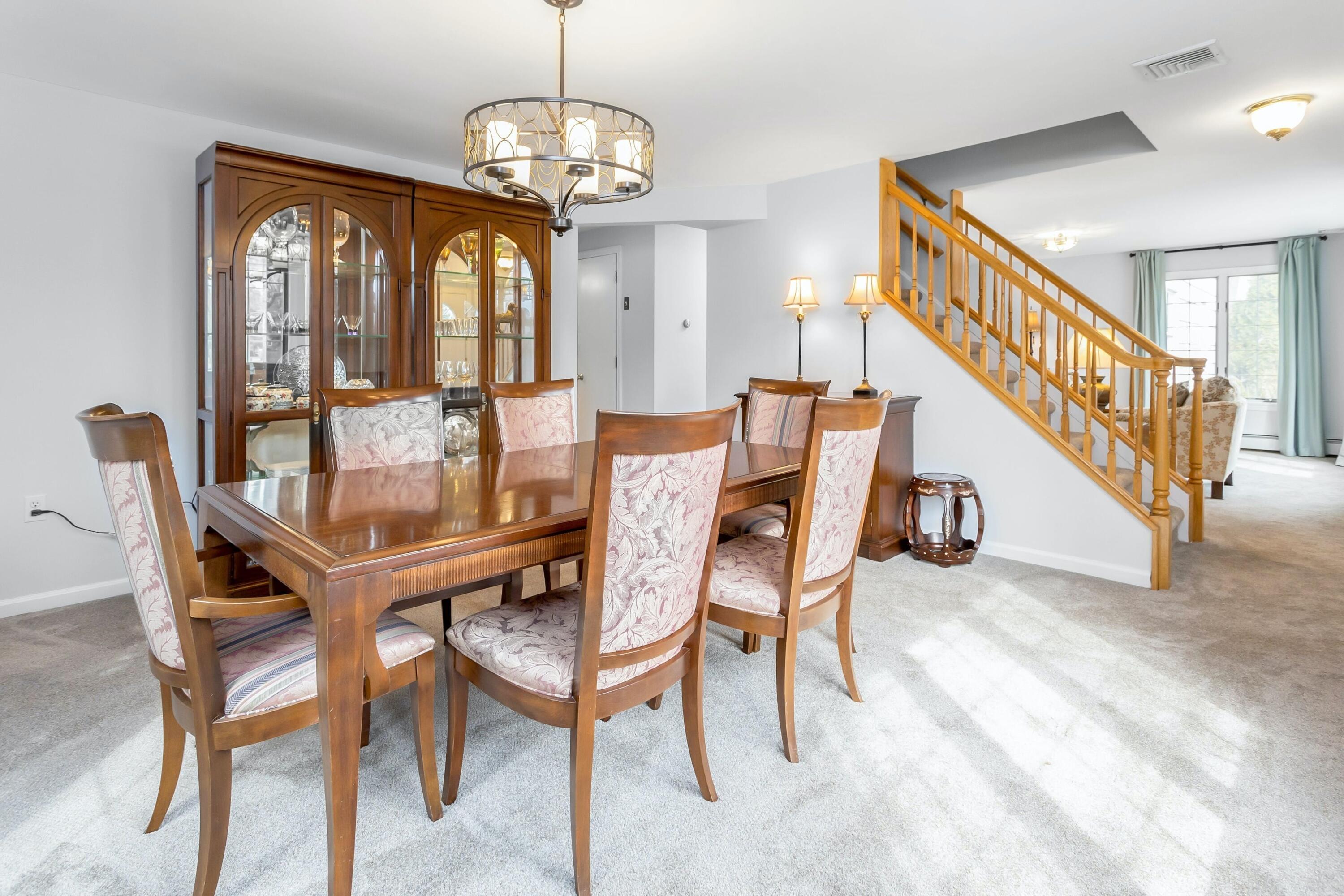 21 Revere Road Darien, CT 06820 - Photo 6 of 40 a view of a dining room with furniture wooden floor and chandelier