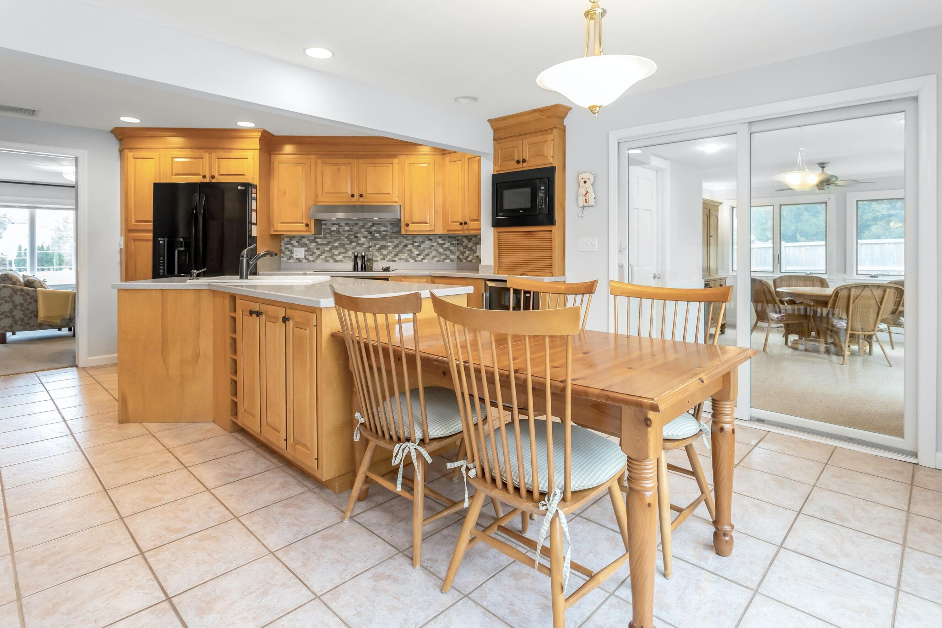 21 Revere Road Darien, CT 06820 - Photo 8 of 40 a view of a dining room with furniture window and outside view