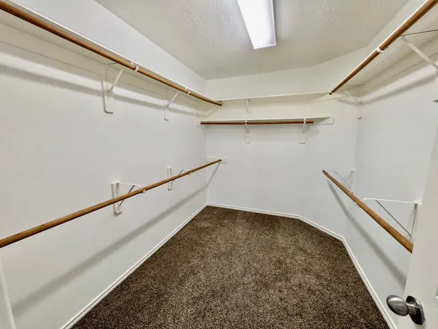 a view of a room with racks on the wall