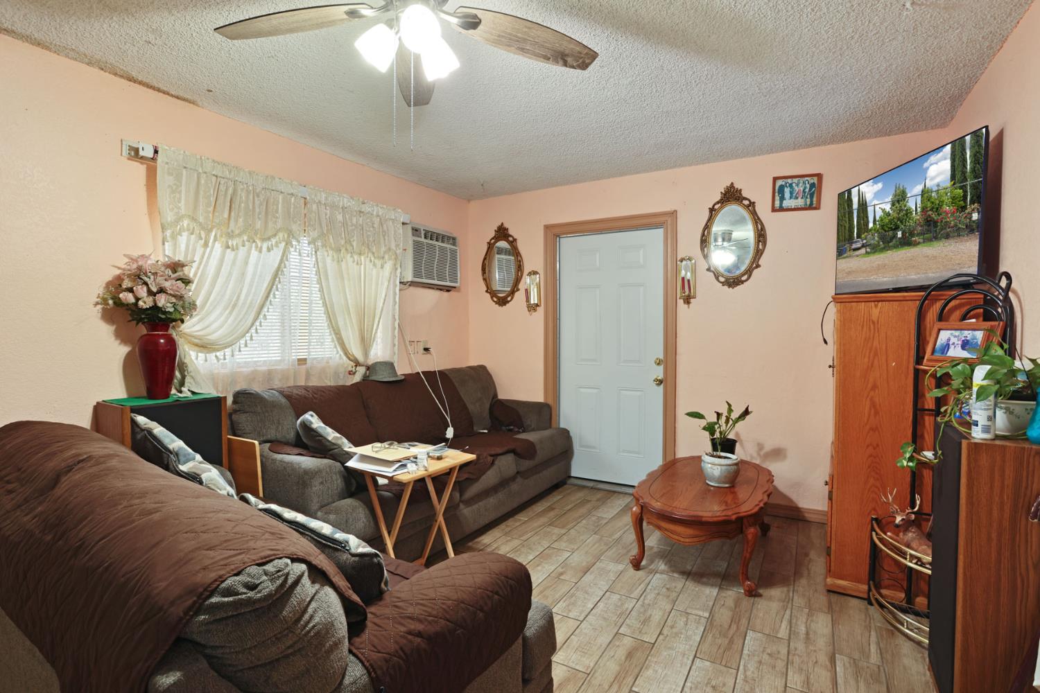 202 Olivero Road Modesto, CA 95358 - Photo 11 of 36 a living room with furniture and wooden floor