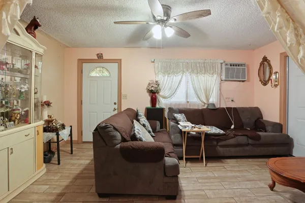 a living room with furniture and a window