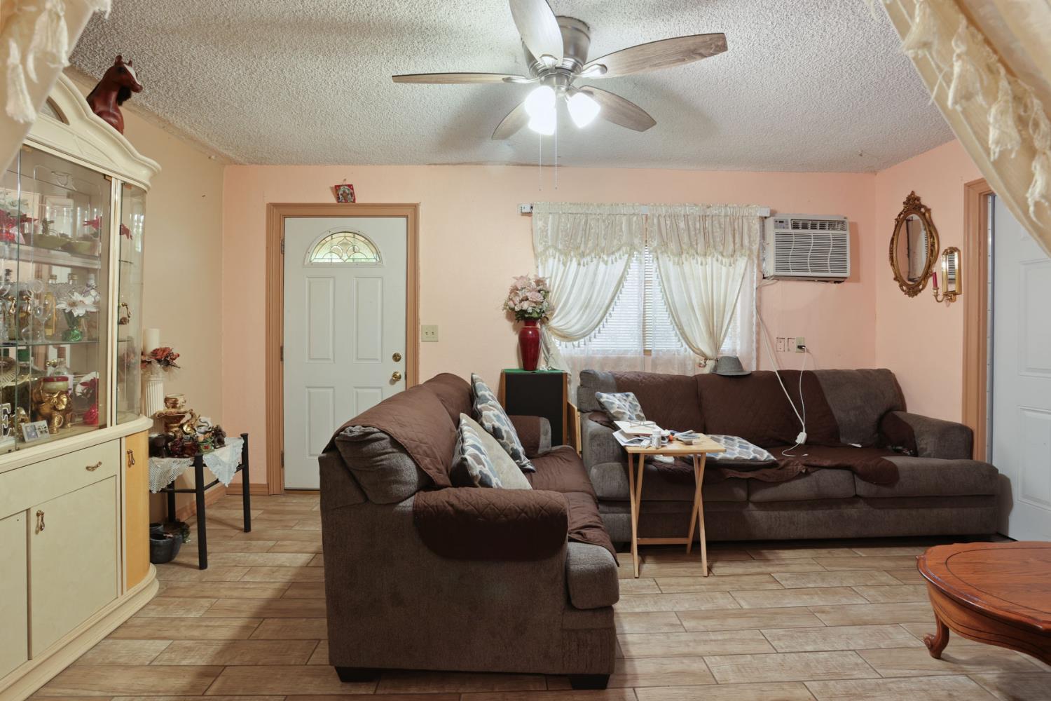 202 Olivero Road Modesto, CA 95358 - Photo 12 of 36 a living room with furniture and a window