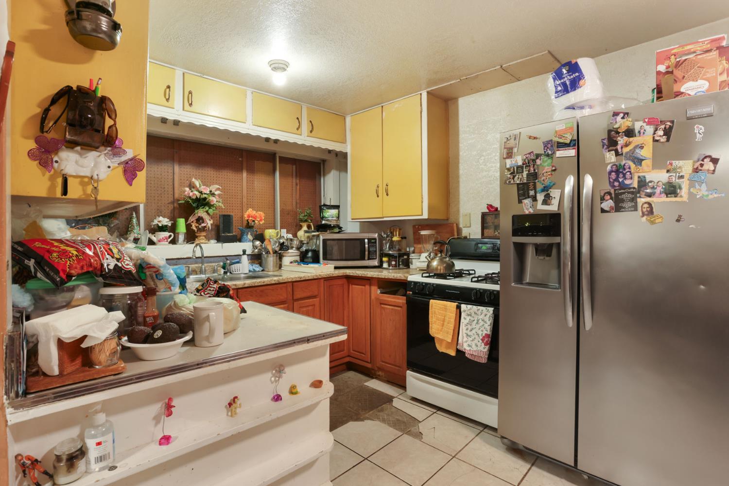 202 Olivero Road Modesto, CA 95358 - Photo 13 of 36 a kitchen with stainless steel appliances granite countertop a stove and cabinets