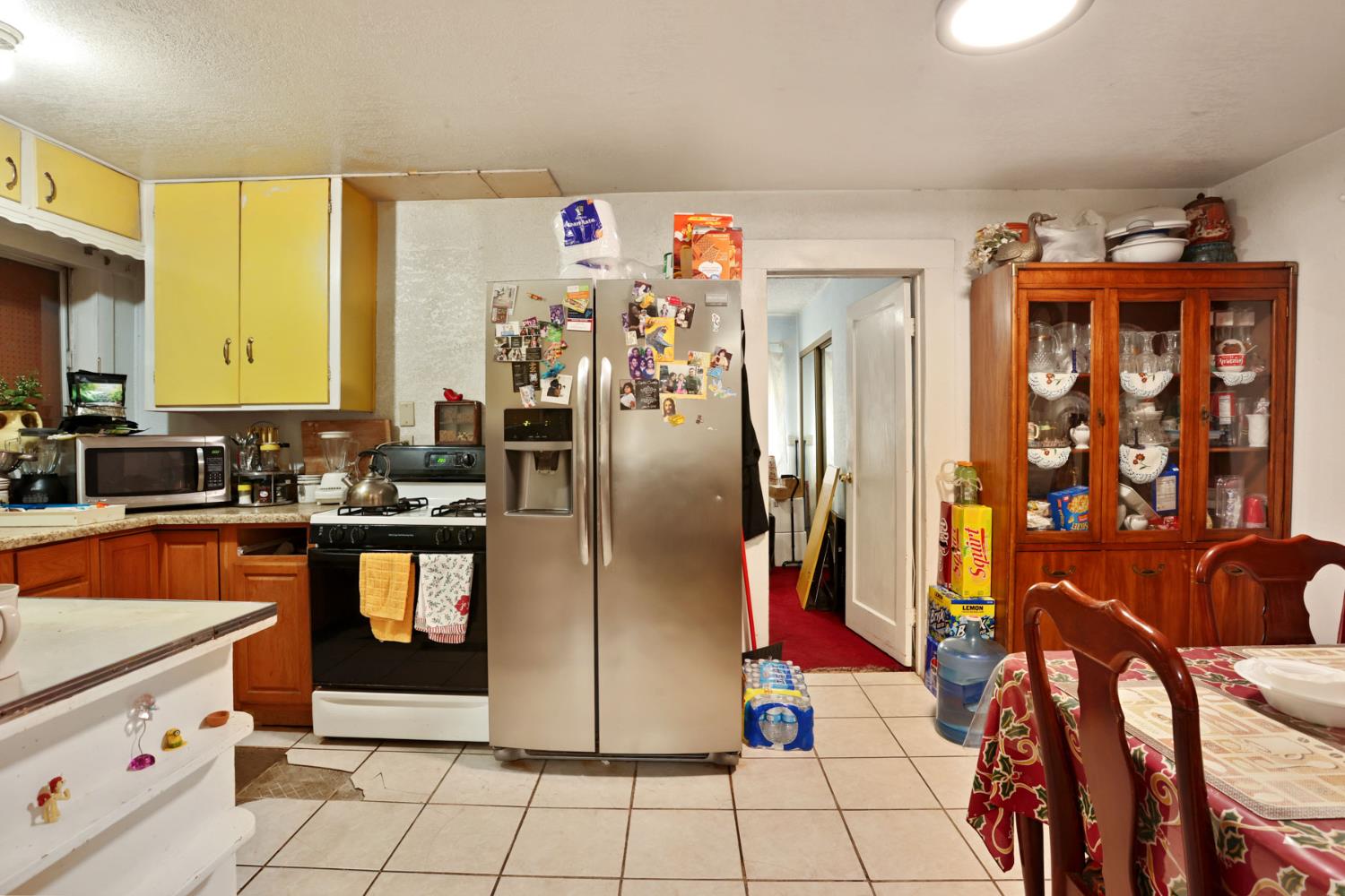 202 Olivero Road Modesto, CA 95358 - Photo 14 of 36 a kitchen with stainless steel appliances granite countertop a refrigerator a stove and a sink