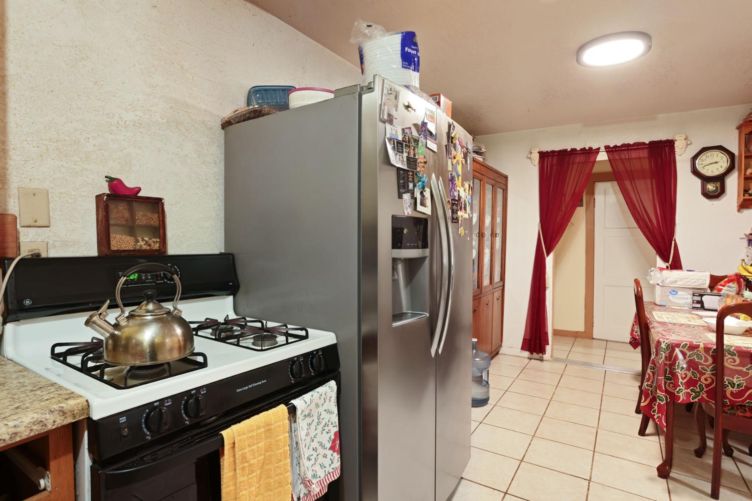202 Olivero Road Modesto, CA 95358 - Photo 18 of 36 a kitchen with stainless steel appliances granite countertop a refrigerator and a stove