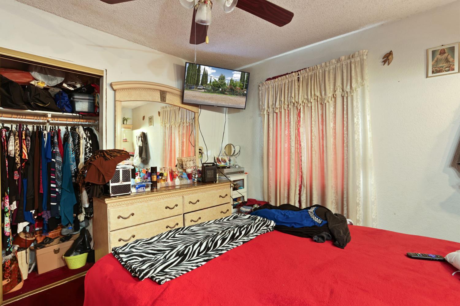 202 Olivero Road Modesto, CA 95358 - Photo 23 of 36 a bedroom with a bed and a window