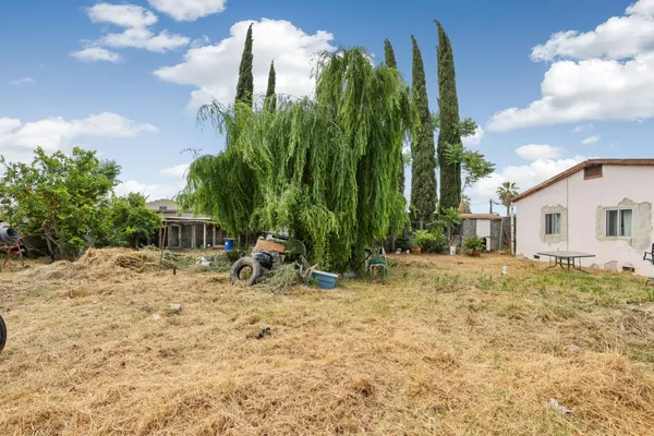 a view of backyard of a house