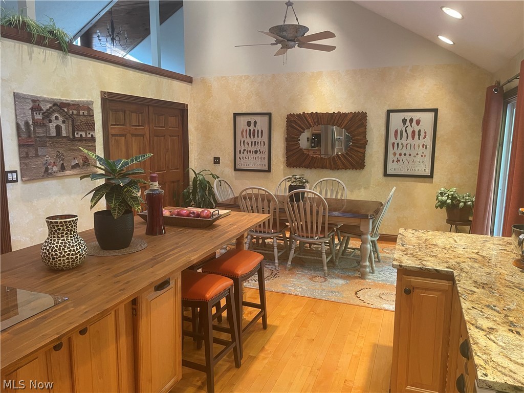 2002 Laurel Ridge Road Culloden, WV 25510 - Photo 10 of 36 Dining space featuring light hardwood / wood-style flooring, ceiling fan, and vaulted ceiling