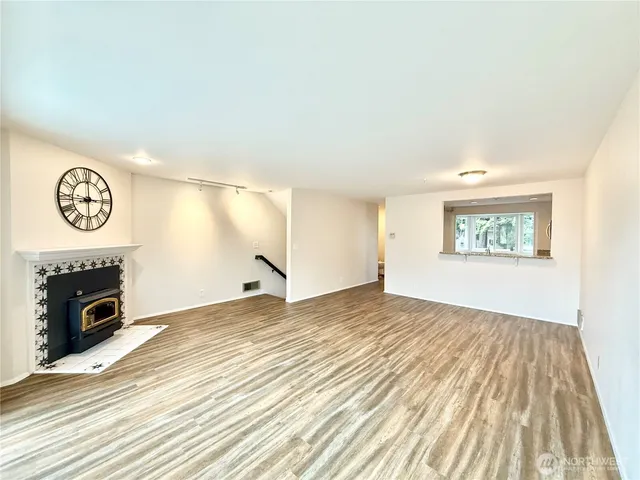 a view of a room with wooden floor and bedroom