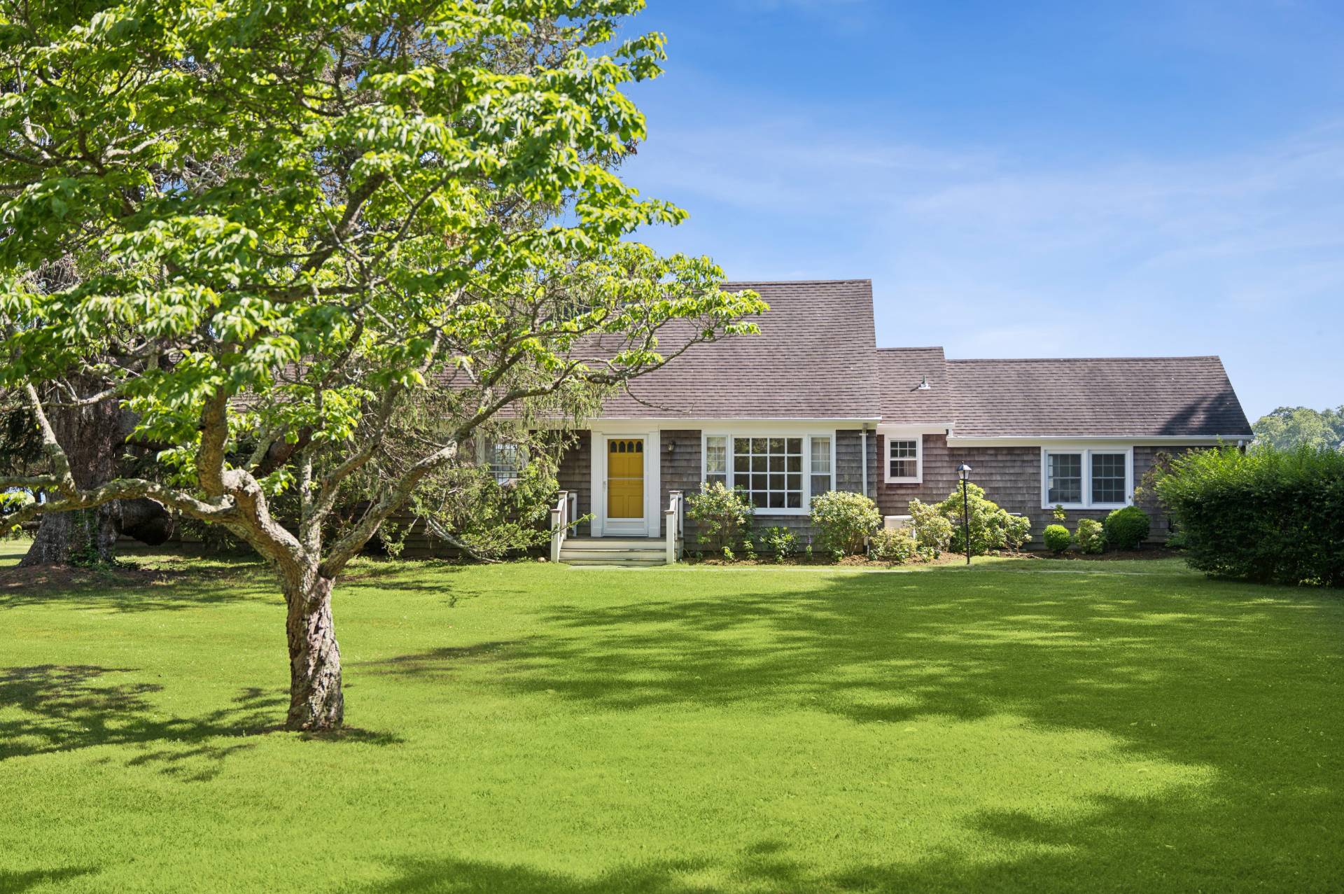 69 Ferry Road Sag Harbor, NY 11963 - Photo 15 of 17 a front view of a house with a yard