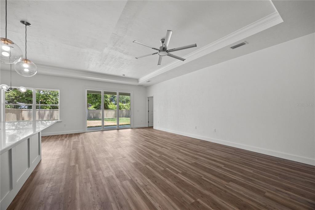 1100 Southwest 67th Drive Gainesville, FL 32607 - Photo 13 of 27 wooden floor in an empty room with a window