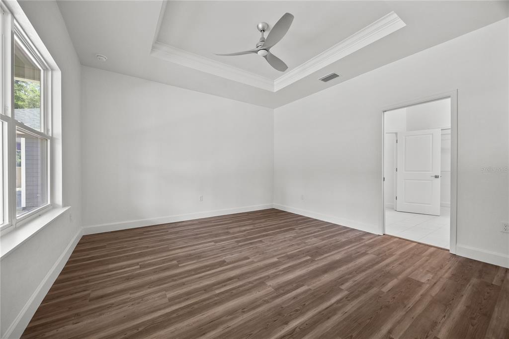 1100 Southwest 67th Drive Gainesville, FL 32607 - Photo 5 of 27 wooden floor in an empty room with a window