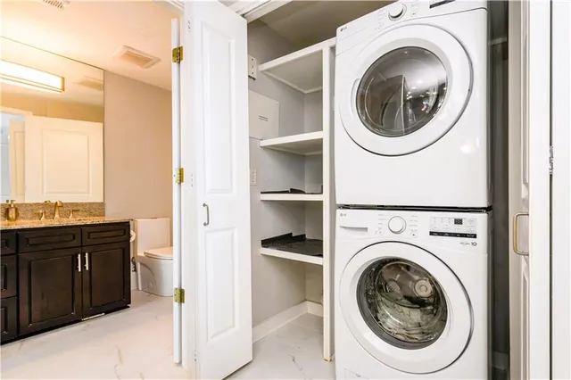 a view of a hallway with washer and dryer