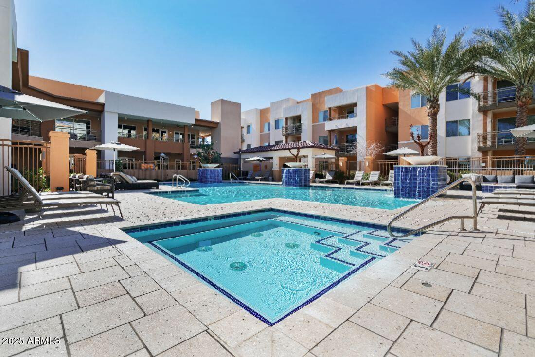 250 East Ray Road, Unit 3 Chandler, AZ 85225 - Photo 9 of 18 a swimming pool with outdoor seating and plants