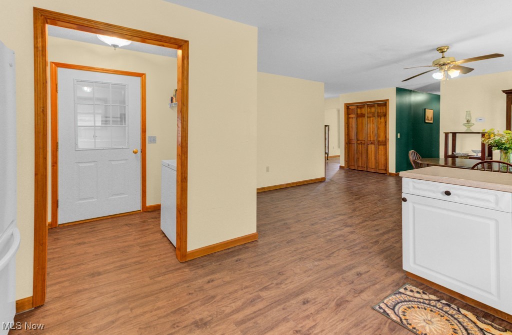 10167 Malibu Road Northeast Minerva, OH 44657 - Photo 7 of 23 Kitchen featuring white cabinetry, ceiling fan, wood finished floors, and light countertops