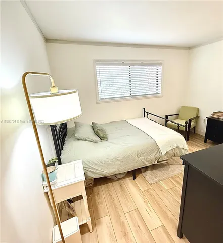 a view of a living room with furniture and a fireplace