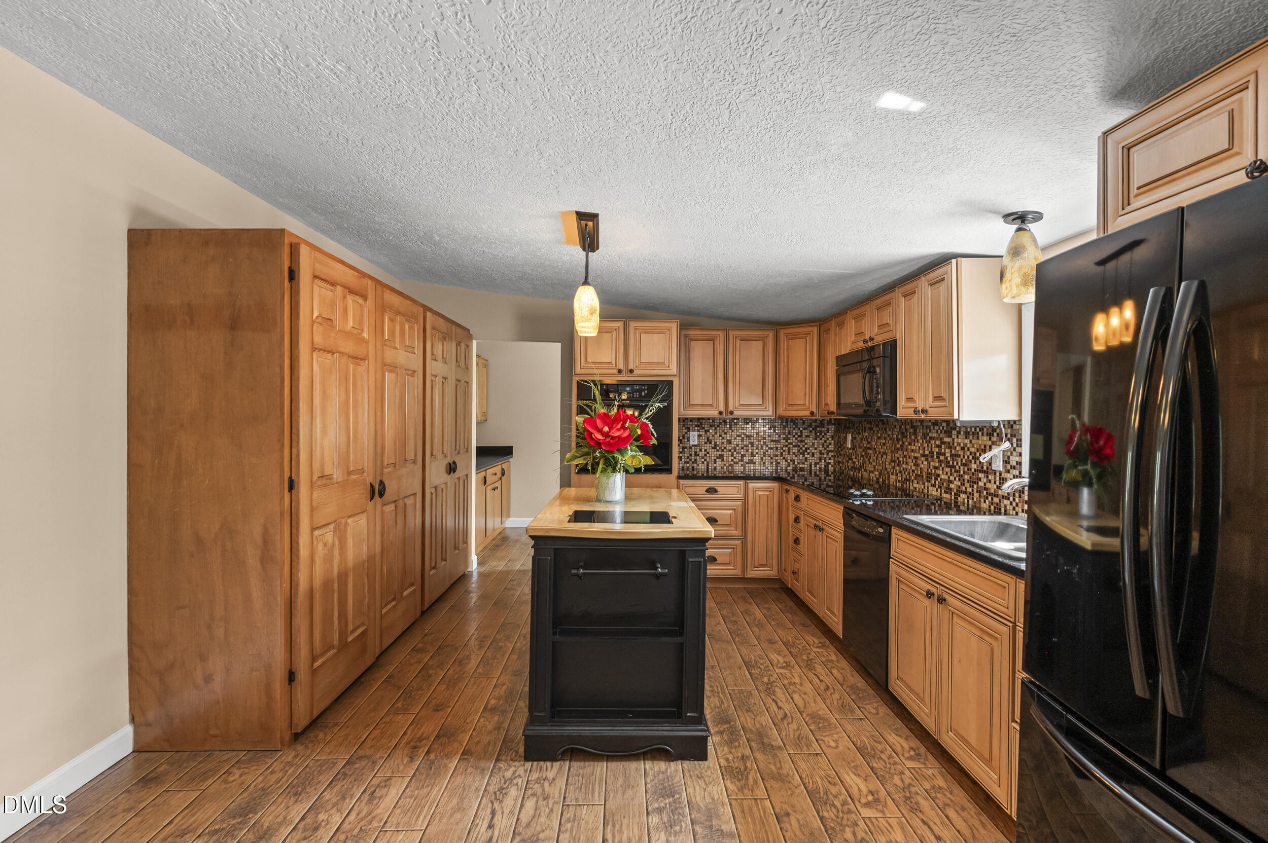221 Pinkney Church Road Fremont, NC 27830 - Photo 9 of 36 a kitchen with stainless steel appliances granite countertop a stove and a refrigerator