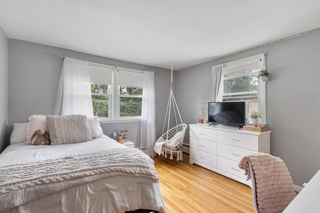 9 Springwell Road Billerica, MA 01821 - Photo 18 of 37 a bedroom with a bed and a flat screen tv