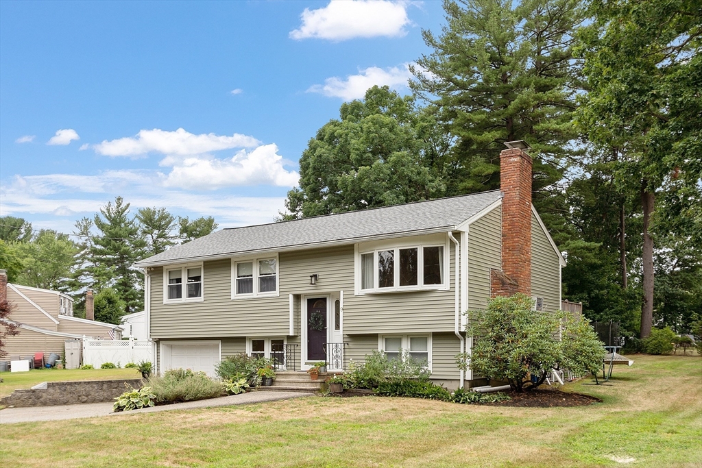 9 Springwell Road Billerica, MA 01821 - Photo 2 of 37 a front view of a house with garden