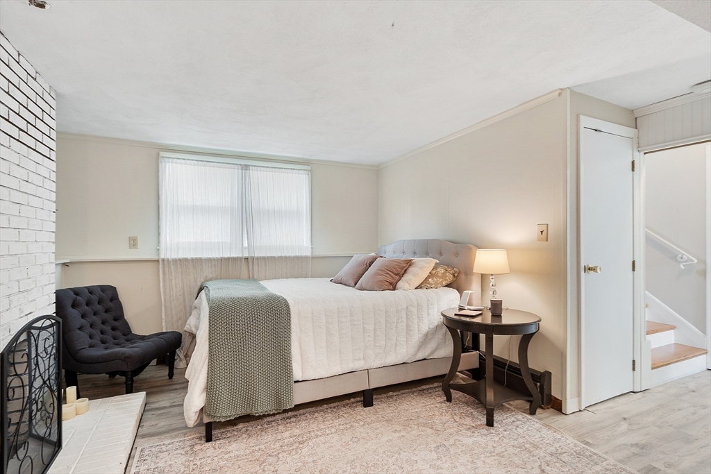 9 Springwell Road Billerica, MA 01821 - Photo 23 of 37 a bedroom with a bed and a chair