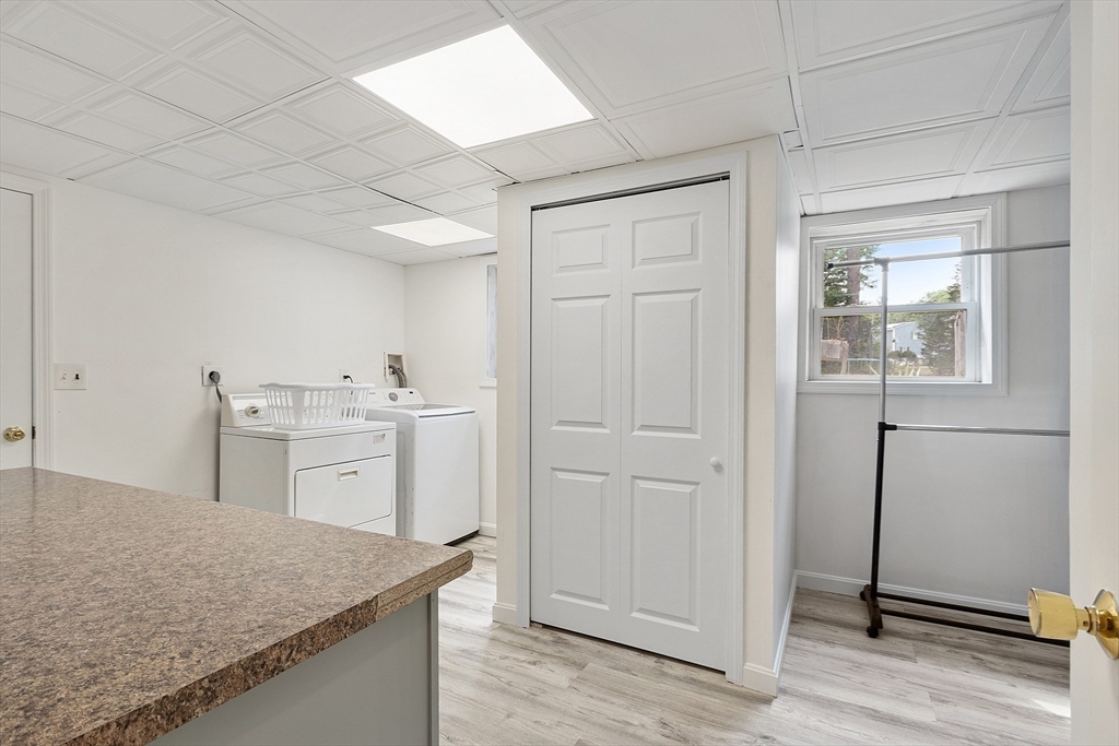 9 Springwell Road Billerica, MA 01821 - Photo 26 of 37 a view of a kitchen with white cabinets