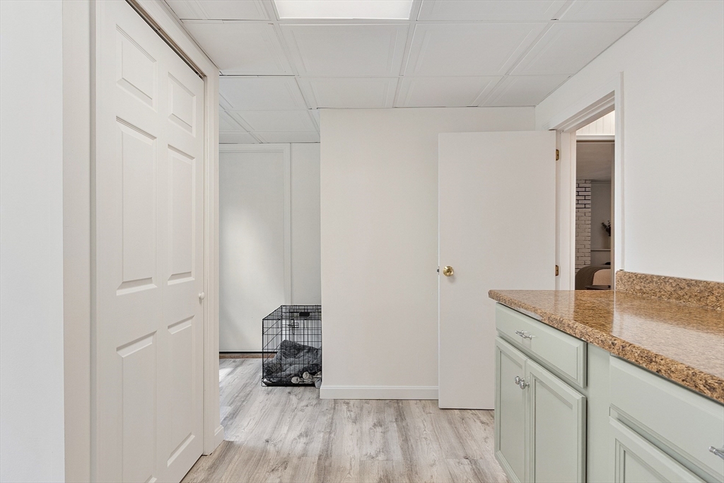 9 Springwell Road Billerica, MA 01821 - Photo 28 of 37 a kitchen with a sink and wooden floor
