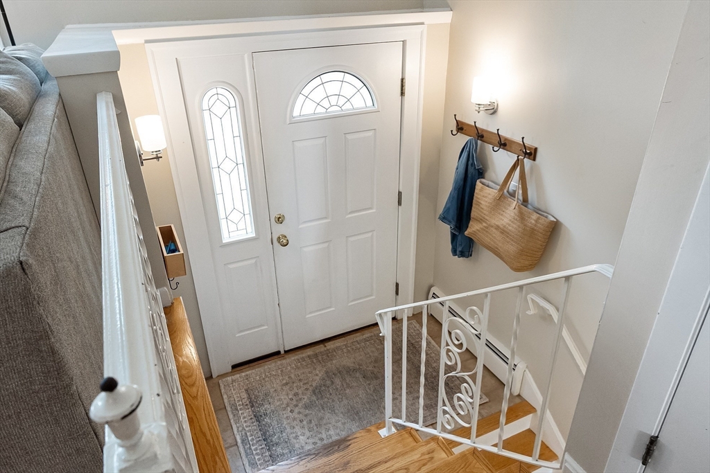 9 Springwell Road Billerica, MA 01821 - Photo 3 of 37 a view of a hallway with windows and stairs